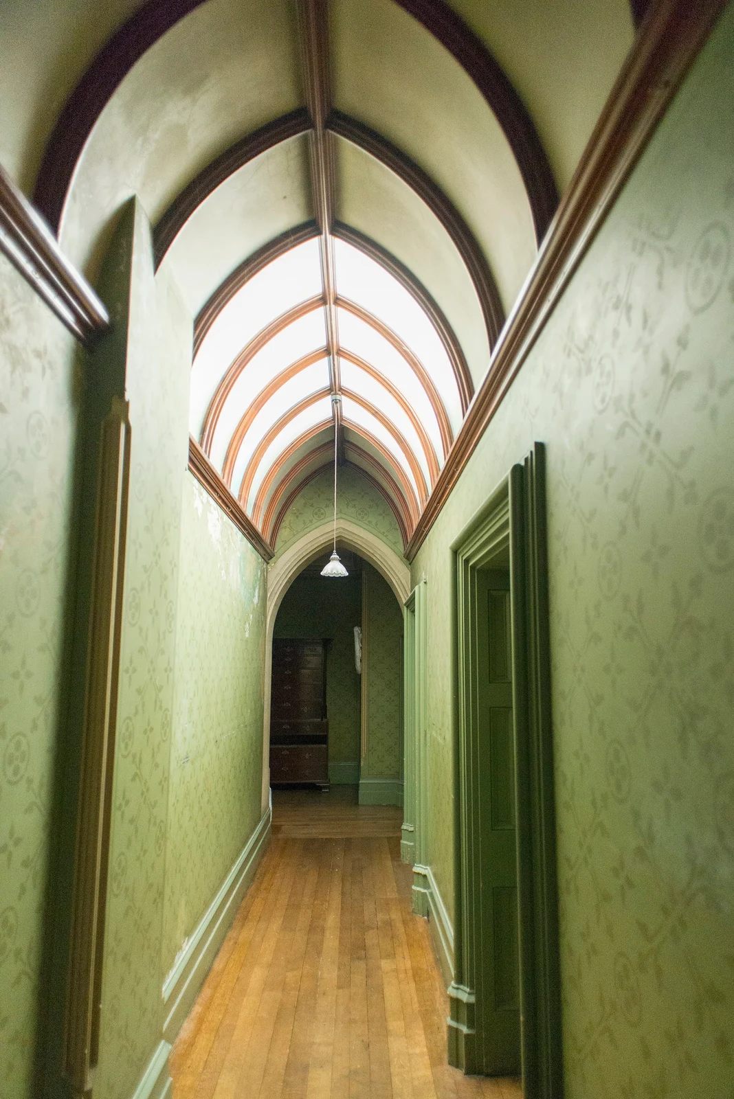Narrow historic hallway with patterned walls