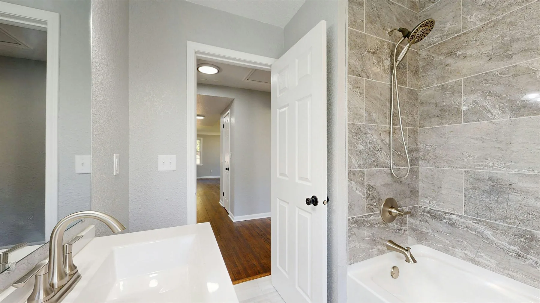 Bathroom with lighter palette, cleaner lines, and a fresher more intentional finish