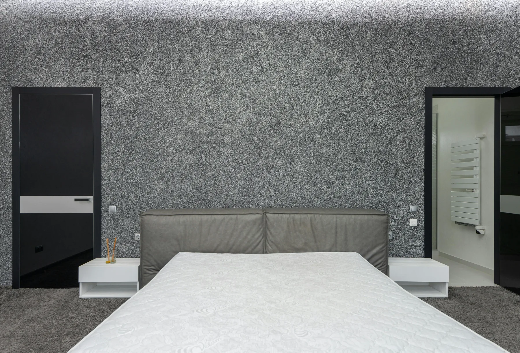 Bedroom where the bed still holds the strongest wall while the rest of the openings stay secondary