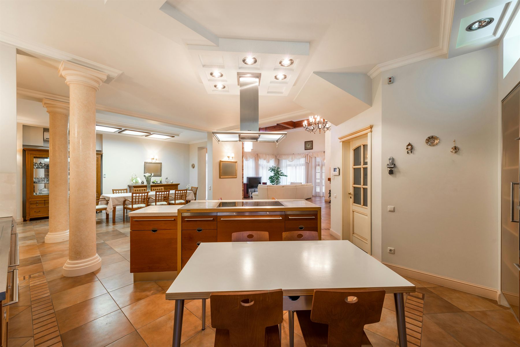 Open-plan home showing a visible dining area beyond the kitchen with a clear route through the space