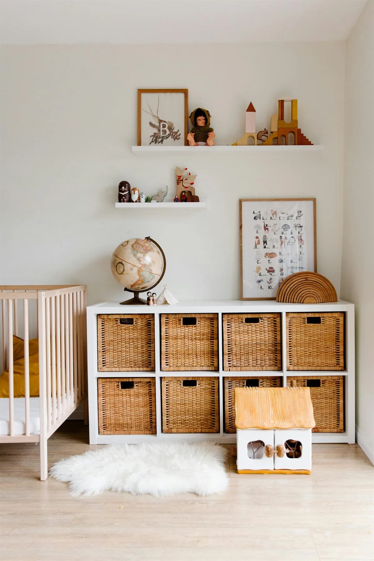 Kids room with woven basket storage, simple shelving, and a calmer toy setup