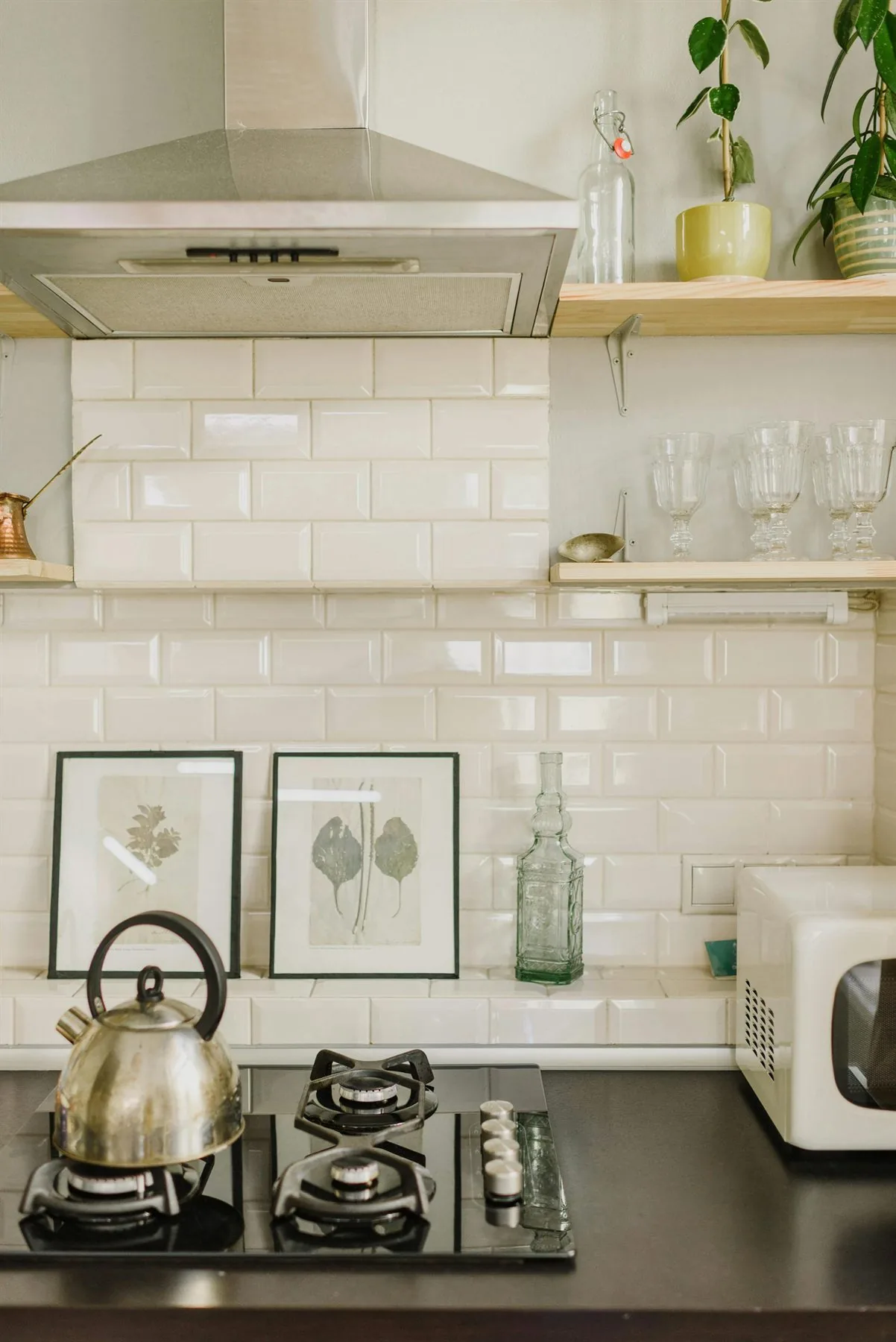Clean kitchen counter with one lamp, one board, and a simple edited arrangement