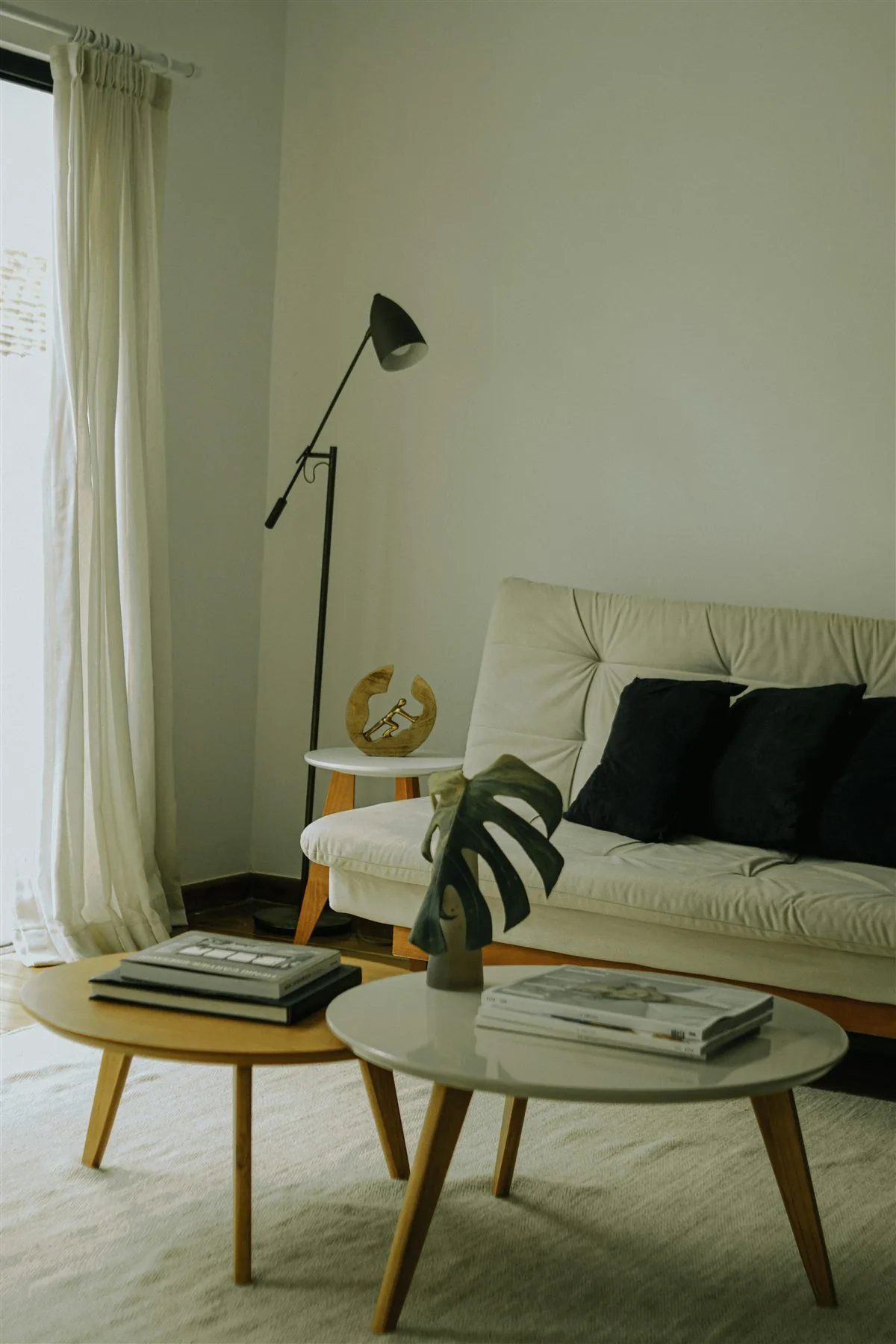 Soft neutral sofa with warm layered styling and a calmer living room layout