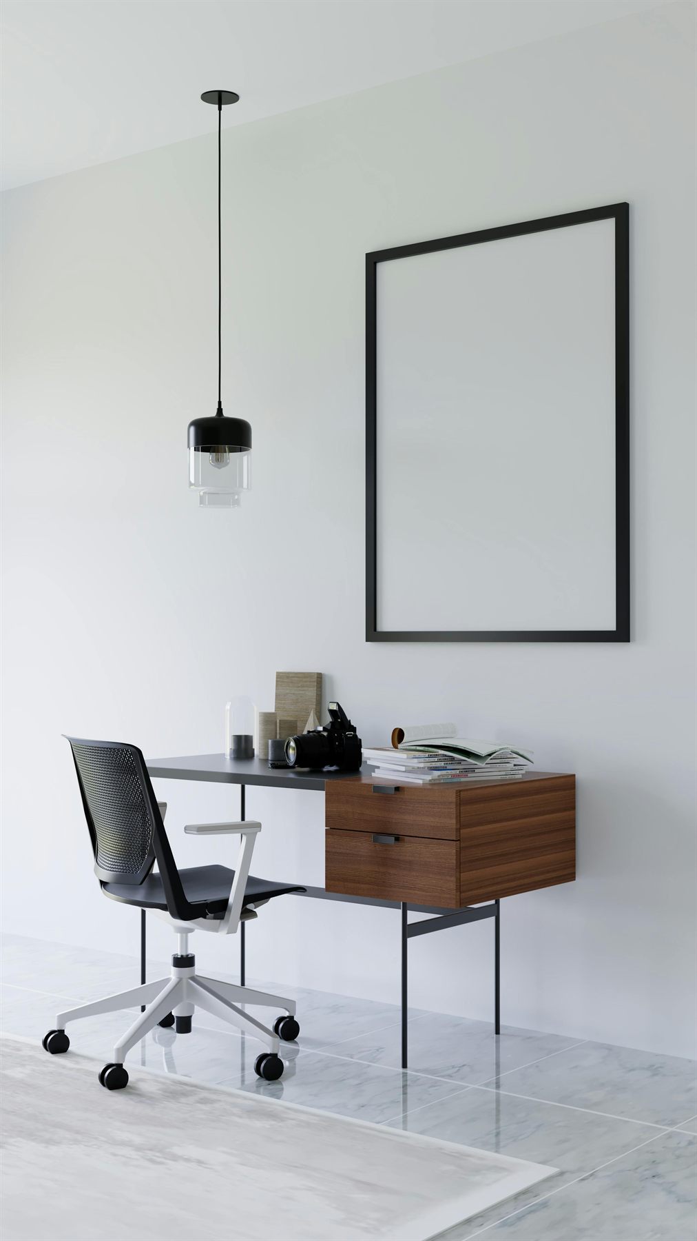 Minimal desk with walnut drawers, black frame, pendant light, and pale wall