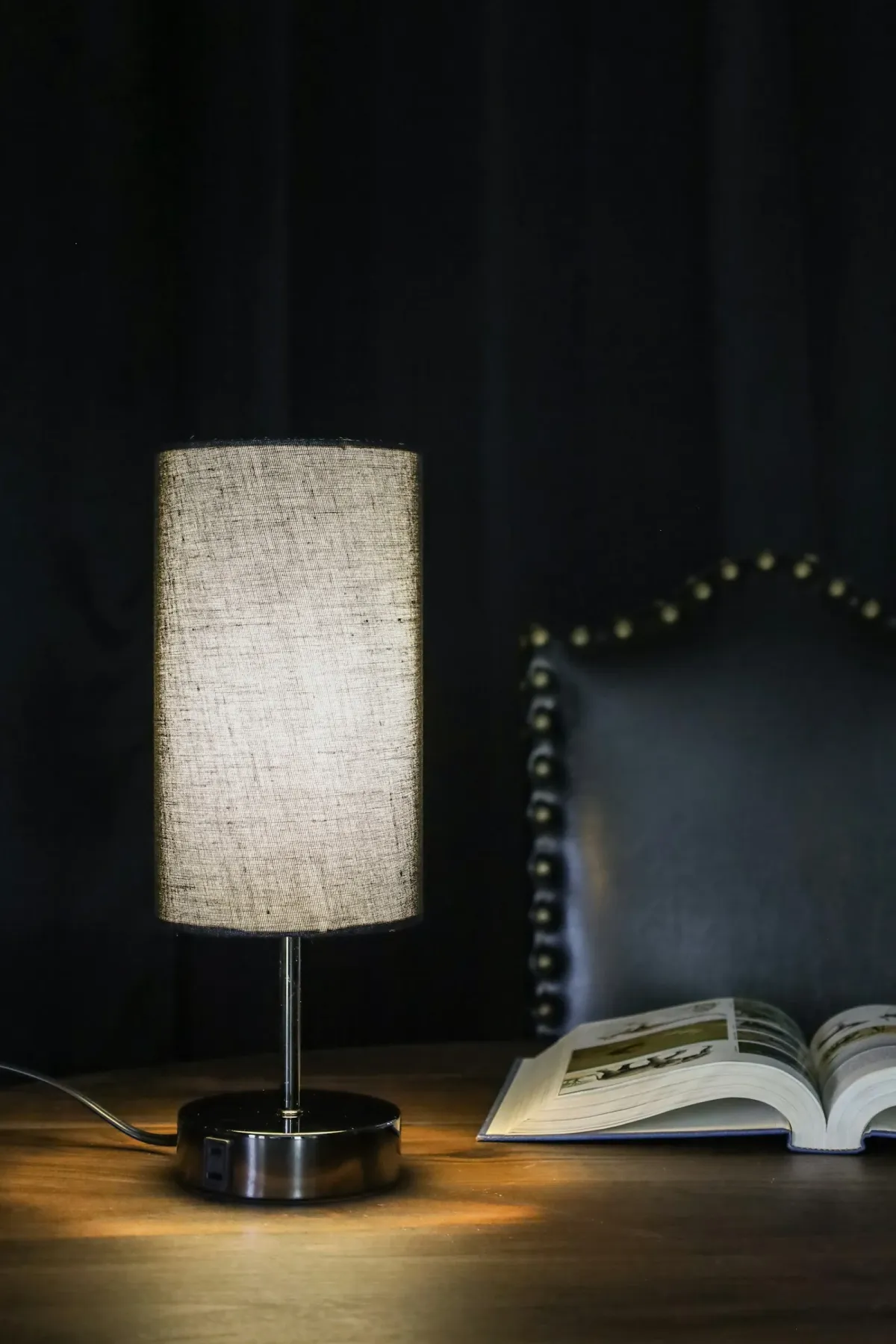 Table lamp beside a book