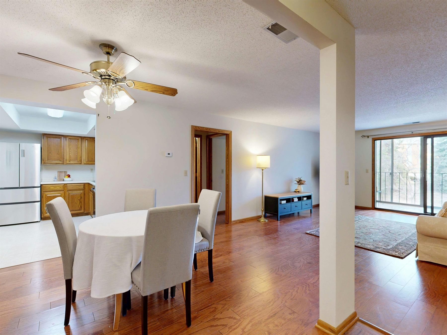 Balanced living room with layered seating, calmer decor, and even visual weight across the space